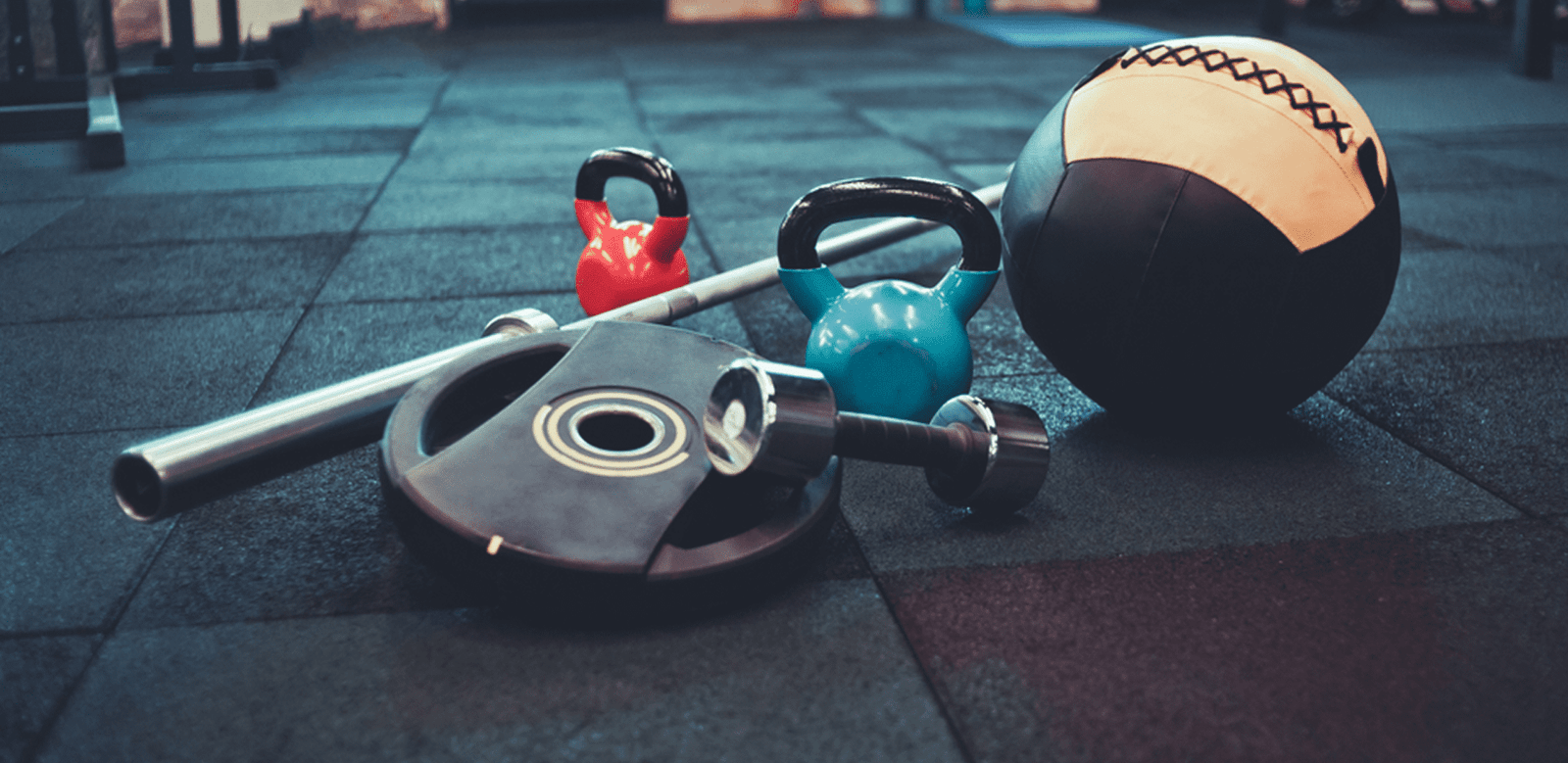 Gym equipment on rubber flooring.